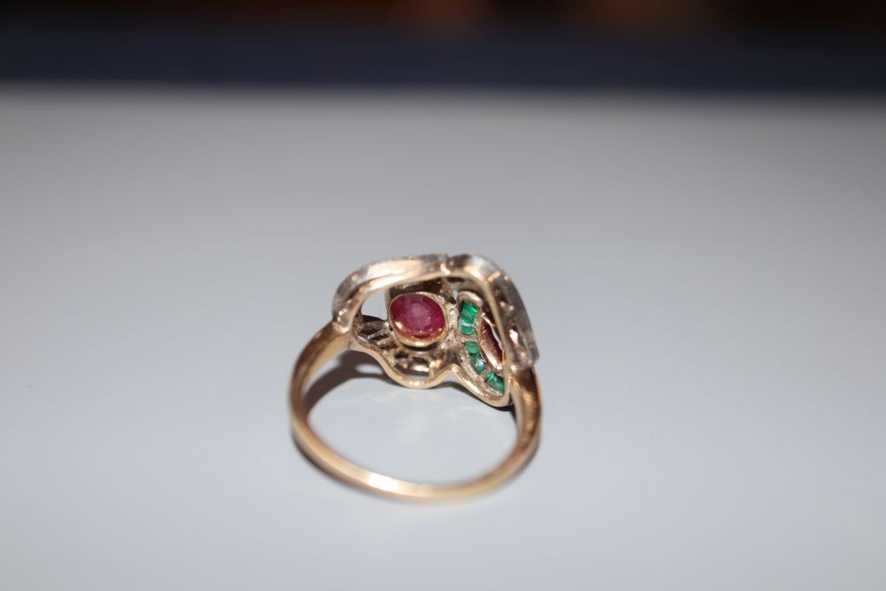 A modern 14k, ruby, emerald and diamond set dress ring, size J, gross 3.1 grams.